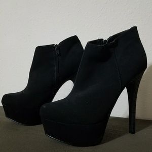 Jet black suede high heel boots